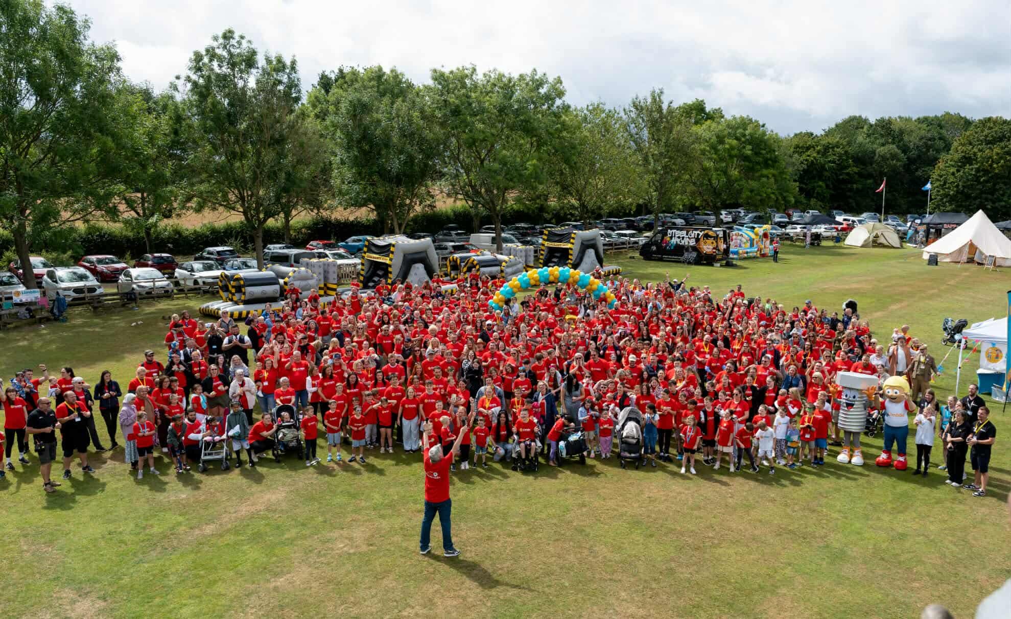 a group shot of 700 people all in red t shirts